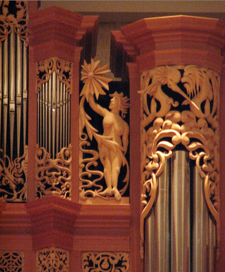 Carved wooden sculpture of woman with sun and sea creatures, carvings for the organ at the Gottfried and Mary Fuchs Organ, Pacific Lutheran University, Tacoma Washington, wood carver Jude Fritts